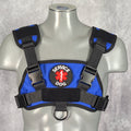 Blue and black service animal harness on a mannequin against a gray background